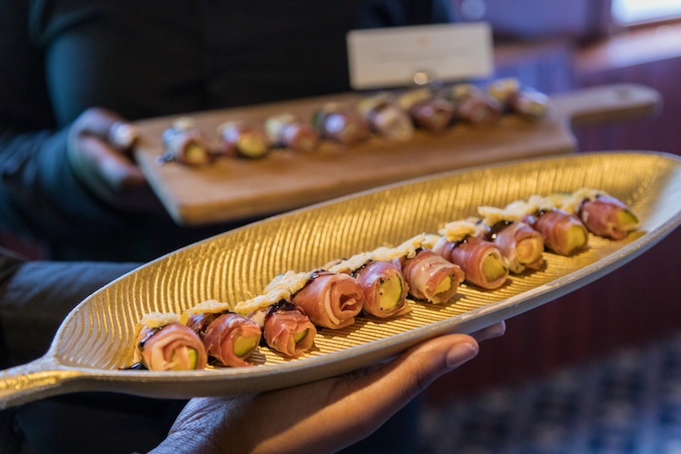Luxury canapés elegantly presented on a platter for corporate events and private charters on the Thames.